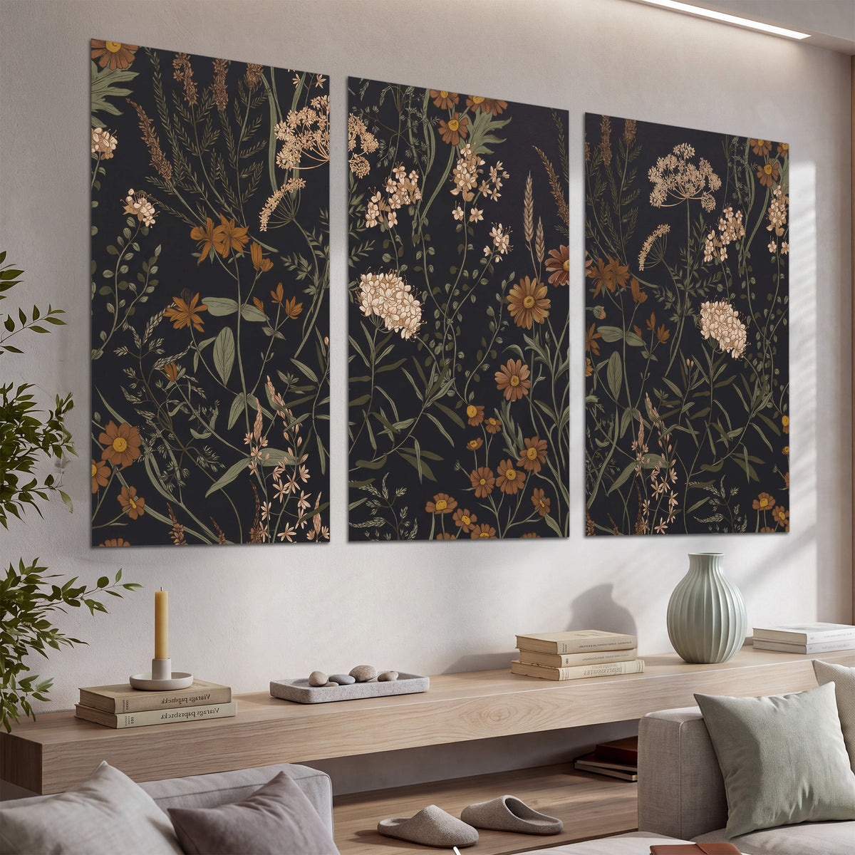 Small cream and rust flowers on a dark botanical background set of 3 poster prints displayed in a console