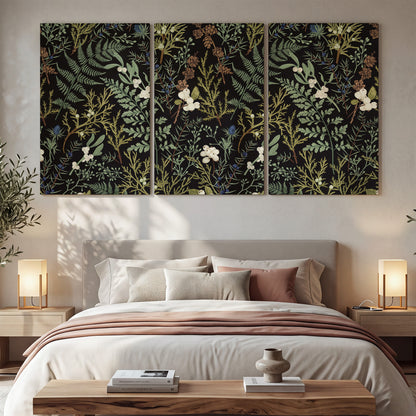 Fine green ferns and cream flowers on a black background 3 piece canvas wall art displayed in a bedroom