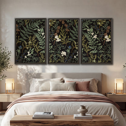 Fine green ferns and cream flowers on a black background 3 piece framed canvas wall art displayed in a bedroom