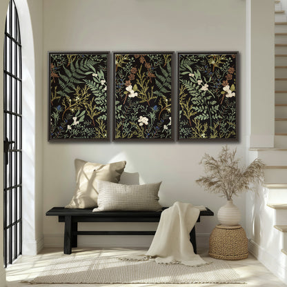 Fine green ferns and cream flowers on a black background 3 piece framed canvas wall art displayed in a entryway