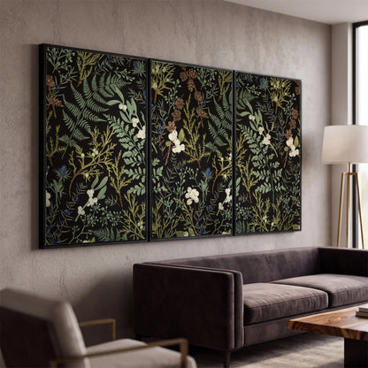 Fine green ferns and cream flowers on a black background 3 piece framed canvas wall art displayed in a modern living room