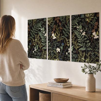 Fine green ferns and cream flowers on a black background set of 3 poster prints three panel arrangement on a wall