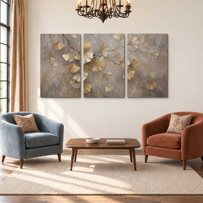 Cream and gold-colored ginkgo leaves against warm gray 3 piece canvas wall art styled in an interior