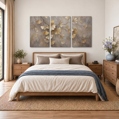 Cream and gold-colored ginkgo leaves against warm gray 3 piece canvas wall art styled in an interior