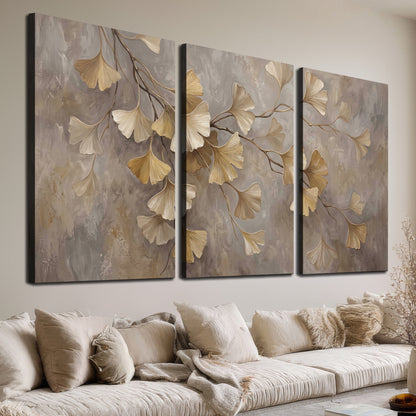 Cream and gold-colored ginkgo leaves against warm gray 3 piece canvas wall art room and product view
