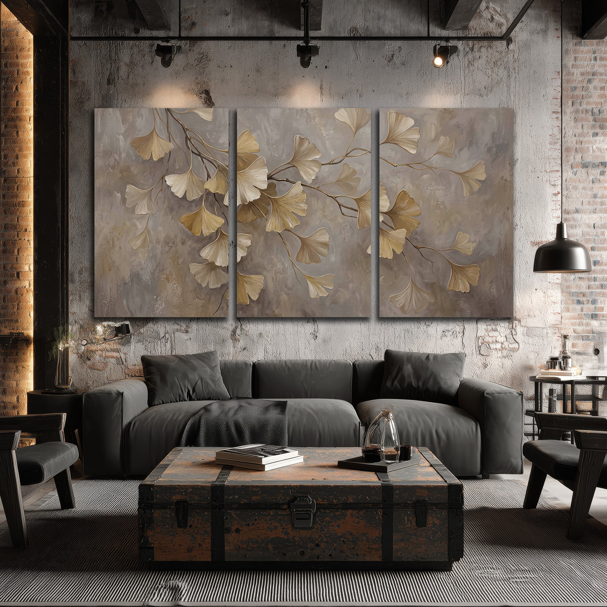 Cream and gold-colored ginkgo leaves against warm gray 3 piece canvas wall art displayed in a industrial room