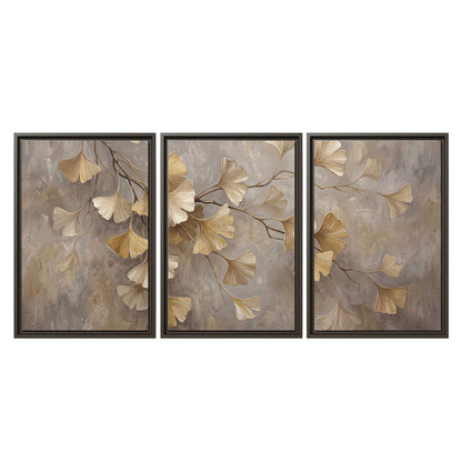 Cream and gold-colored ginkgo leaves against warm gray 3 piece framed canvas wall art viewed straight on