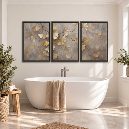 Cream and gold-colored ginkgo leaves against warm gray 3 piece framed canvas wall art styled in an interior