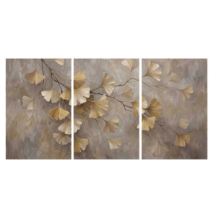 Cream and gold-colored ginkgo leaves against warm gray set of 3 poster prints viewed straight on