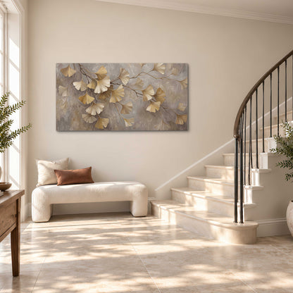 Cream and gold-colored ginkgo leaves against warm gray single canvas wall art styled in an interior