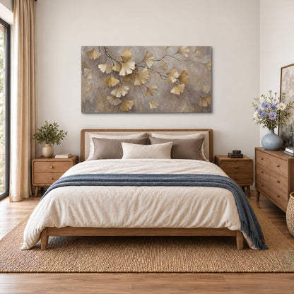 Cream and gold-colored ginkgo leaves against warm gray single canvas wall art styled in an interior