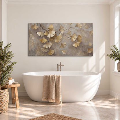Cream and gold-colored ginkgo leaves against warm gray single canvas wall art styled in an interior