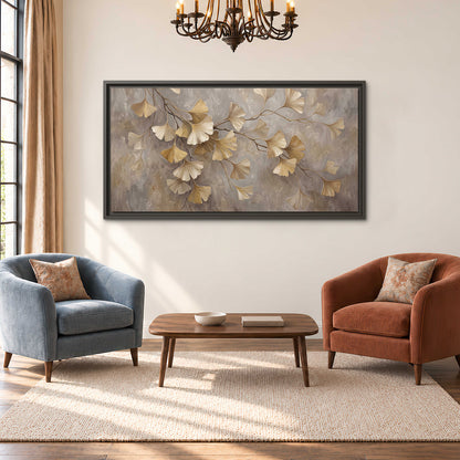 Cream and gold-colored ginkgo leaves against warm gray single framed canvas wall art styled in an interior