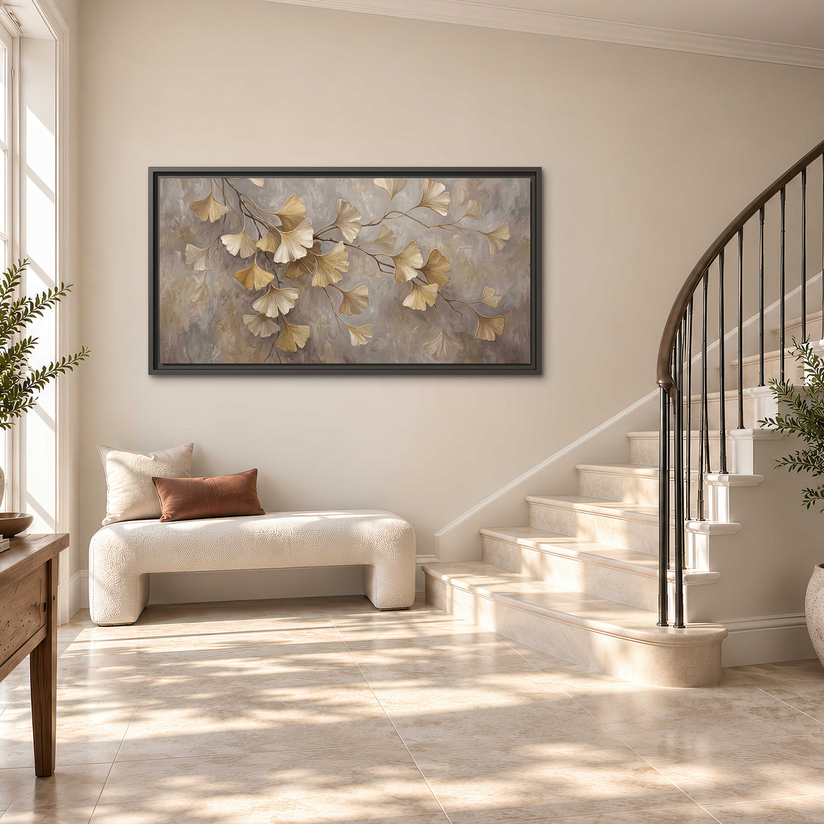 Cream and gold-colored ginkgo leaves against warm gray single framed canvas wall art styled in an interior