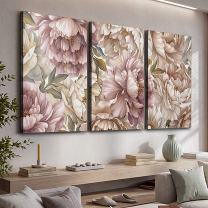 Layered soft pink and ivory flowers with sage leaves 3 piece canvas wall art displayed in a console