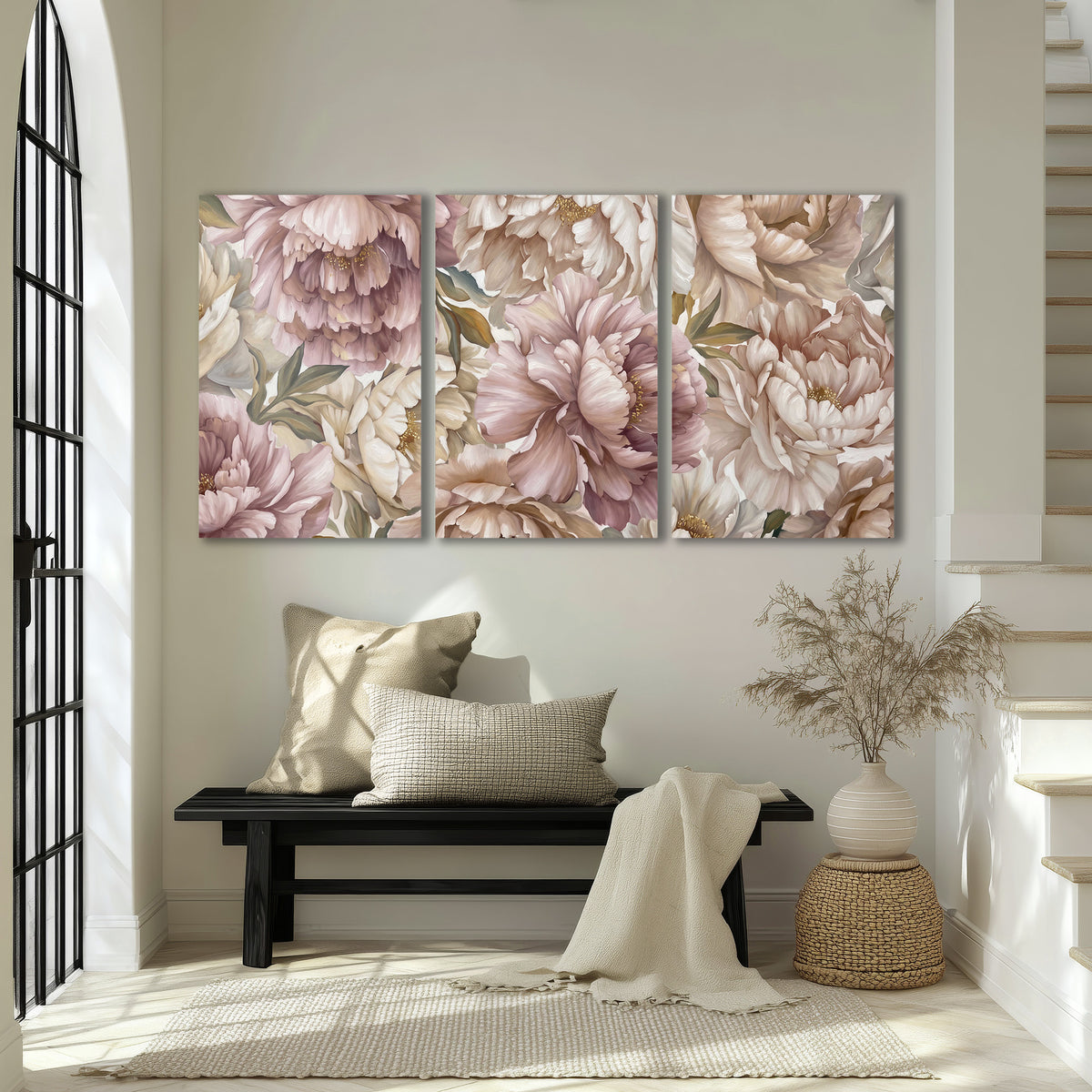 Layered soft pink and ivory flowers with sage leaves 3 piece canvas wall art displayed in a entryway