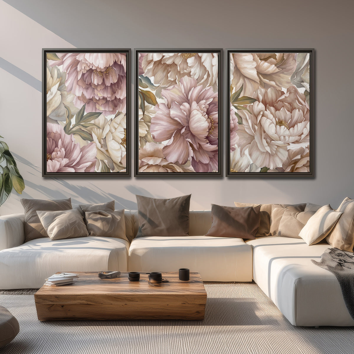 Layered soft pink and ivory flowers with sage leaves 3 piece framed canvas wall art displayed in a living room