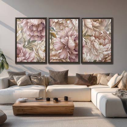 Layered soft pink and ivory flowers with sage leaves 3 piece framed canvas wall art displayed in a living room