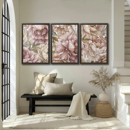 Layered soft pink and ivory flowers with sage leaves 3 piece framed canvas wall art displayed in a entryway