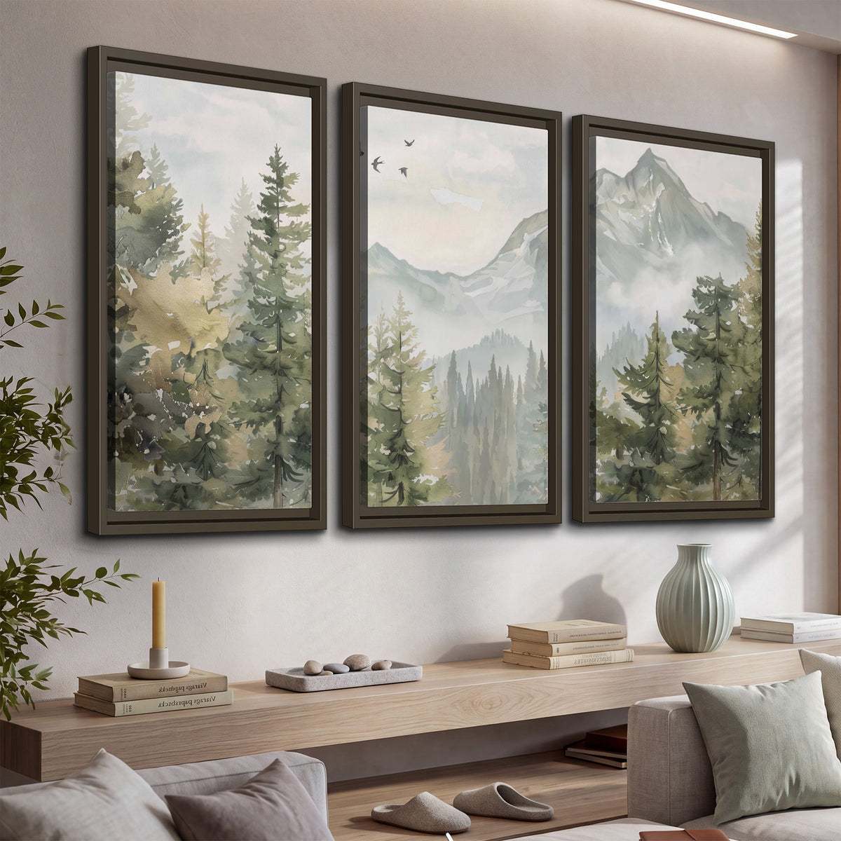 Soft green mountain peaks and evergreen trees beneath birds 3 piece framed canvas wall art displayed in a console
