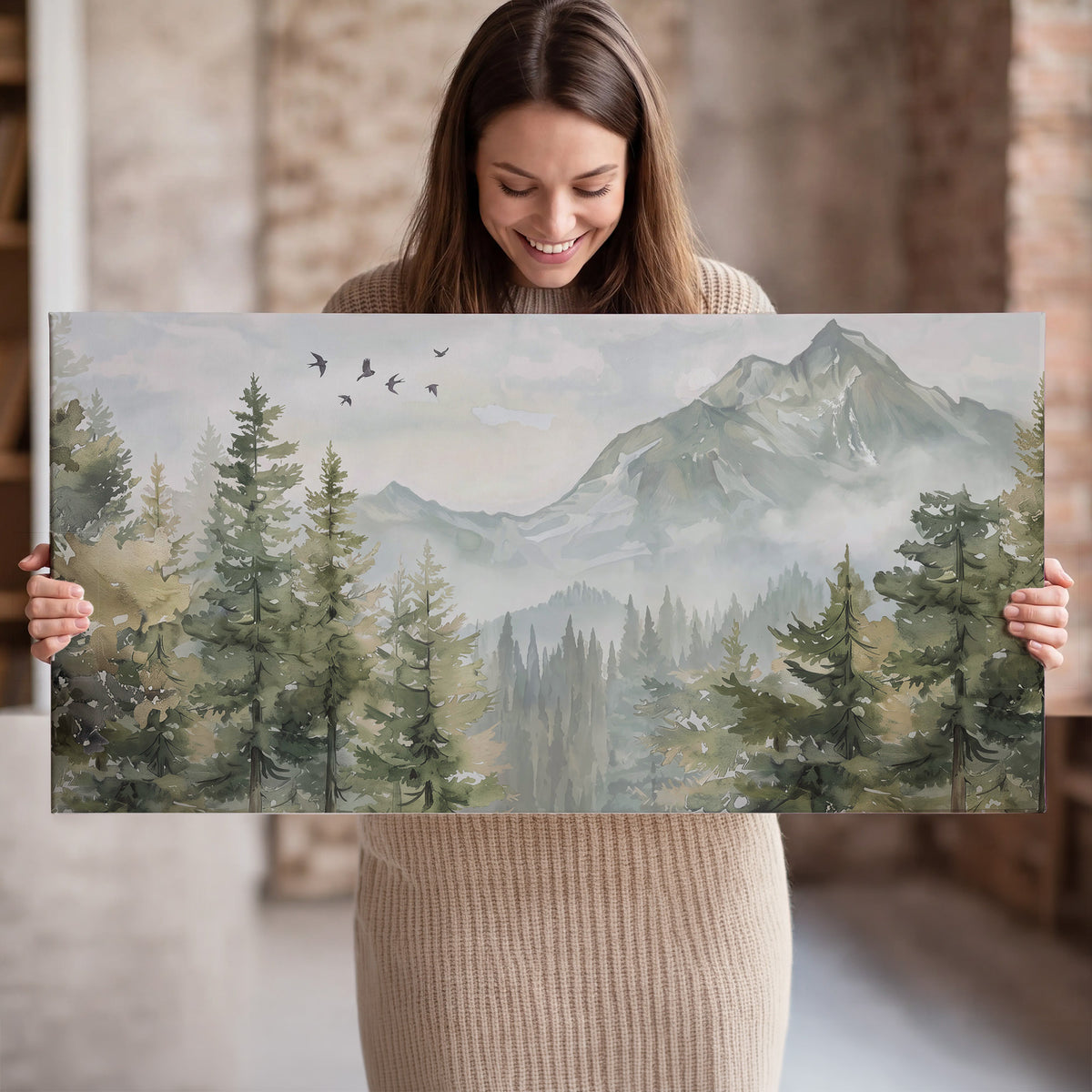 Soft green mountain peaks and evergreen trees beneath birds single canvas wall art held in hands
