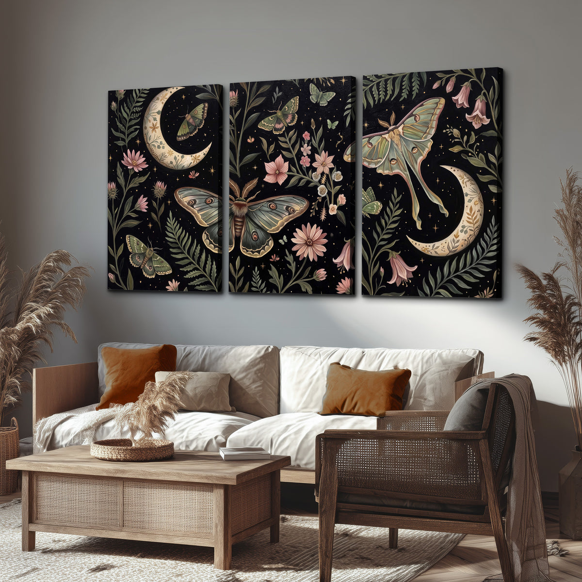 Decorative moths, crescent moons and flowers on black 3 piece canvas wall art displayed in a rustic living room