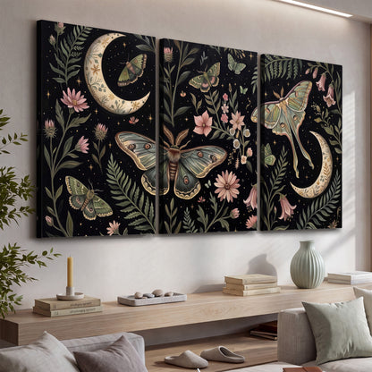 Decorative moths, crescent moons and flowers on black 3 piece canvas wall art displayed in a console