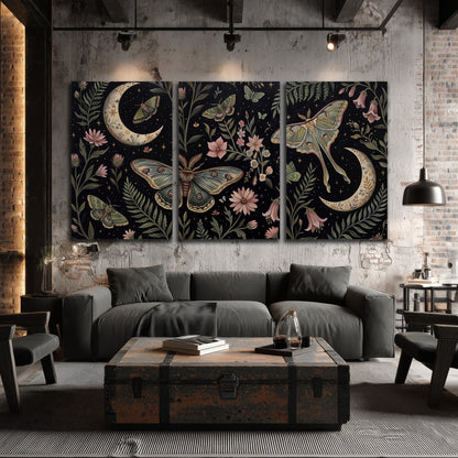 Decorative moths, crescent moons and flowers on black 3 piece canvas wall art displayed in a industrial room