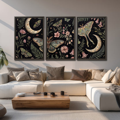 Decorative moths, crescent moons and flowers on black 3 piece framed canvas wall art displayed in a living room