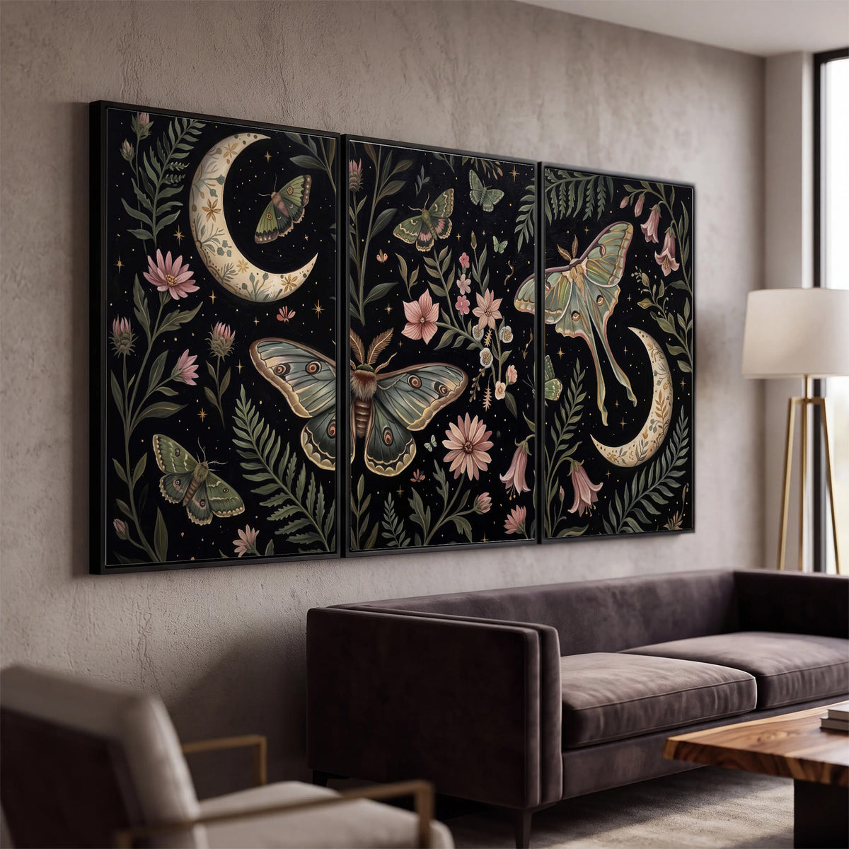 Decorative moths, crescent moons and flowers on black 3 piece framed canvas wall art displayed in a modern living room