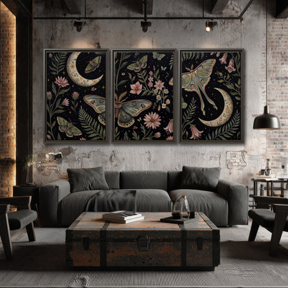 Decorative moths, crescent moons and flowers on black 3 piece framed canvas wall art displayed in a industrial room