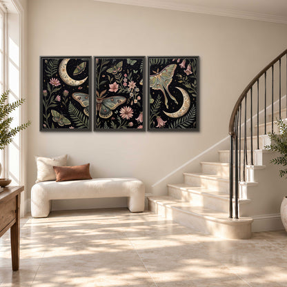 Decorative moths, crescent moons and flowers on black 3 piece framed canvas wall art styled in an interior