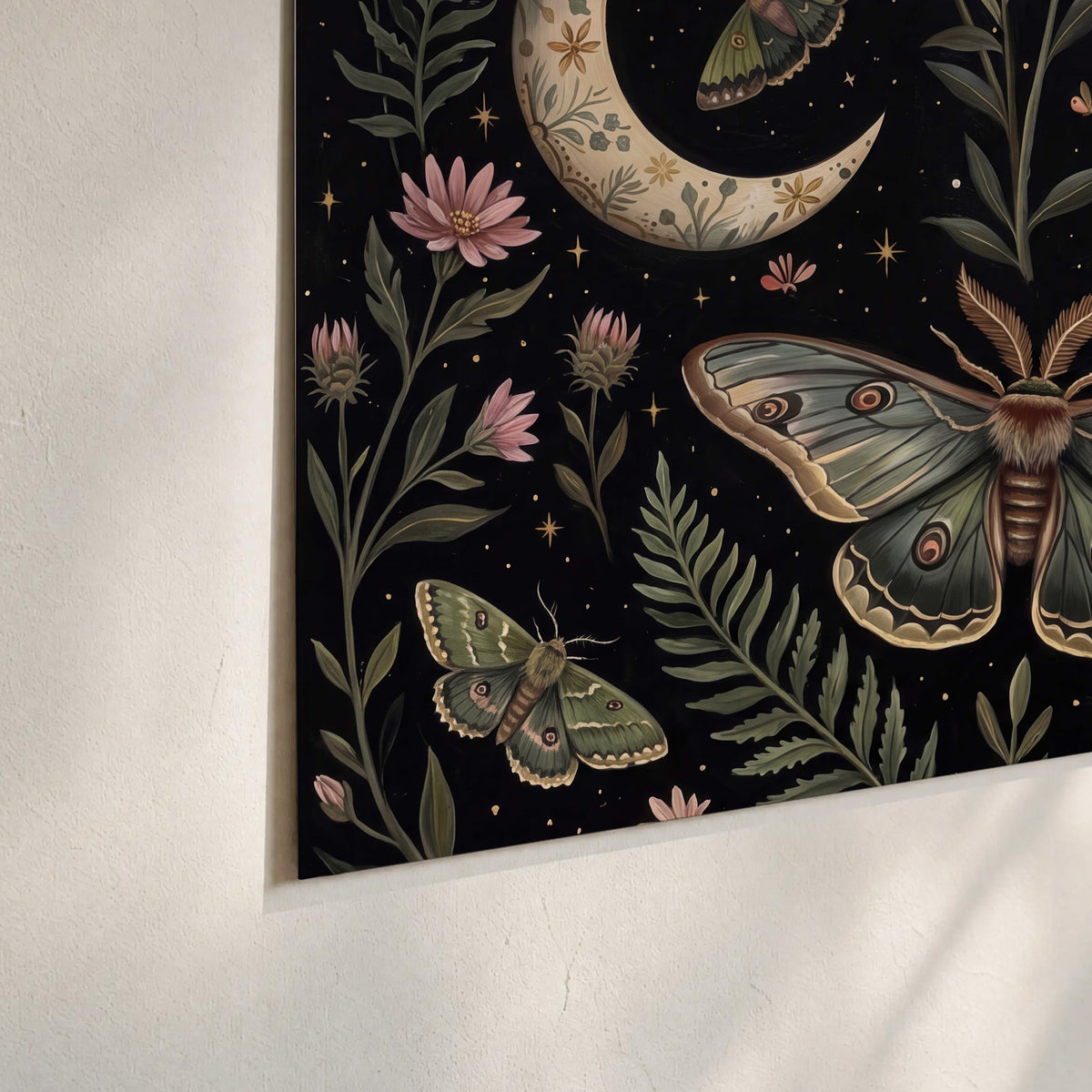 Decorative moths, crescent moons and flowers on black set of 3 poster prints material and edge close up