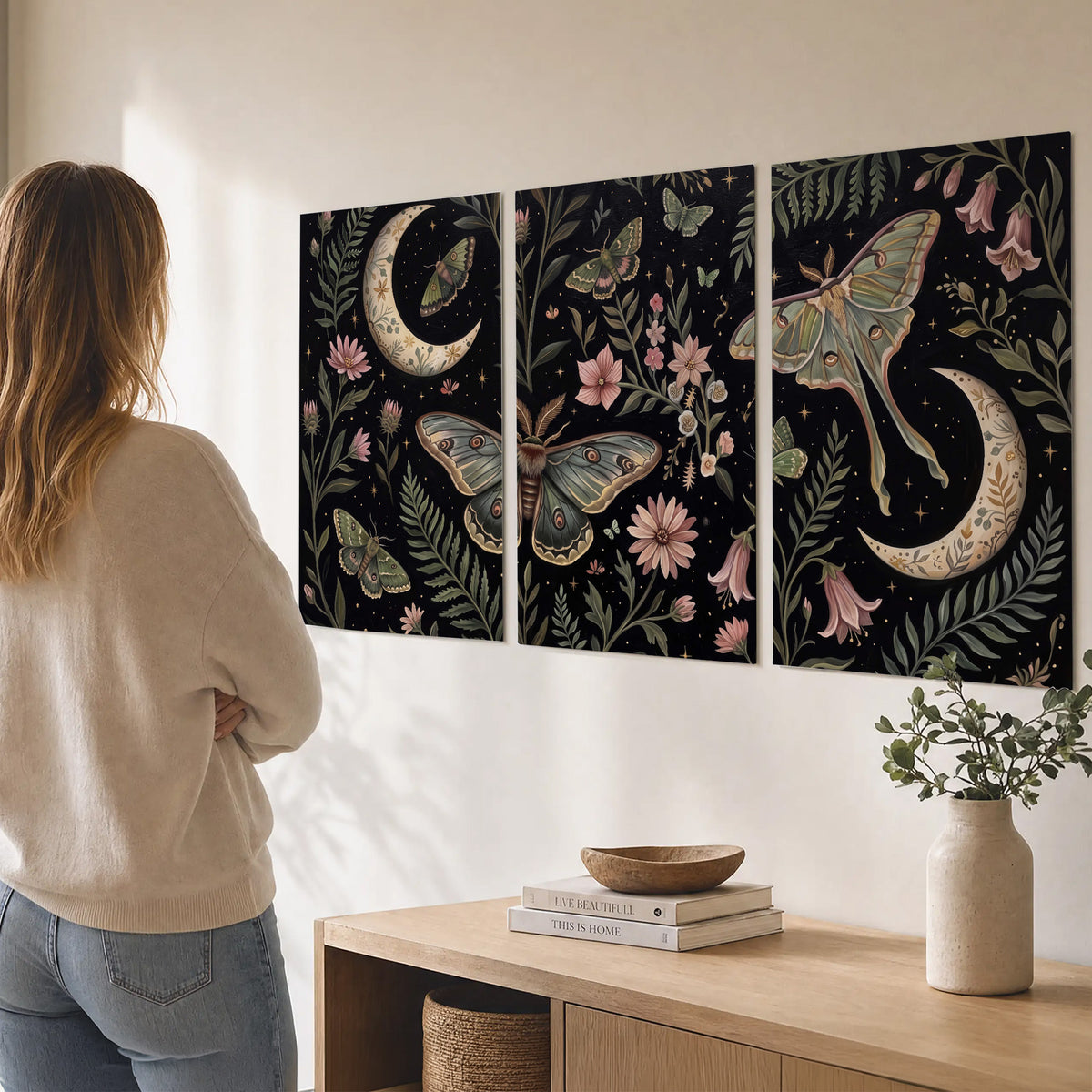 Decorative moths, crescent moons and flowers on black set of 3 poster prints three panel arrangement on a wall