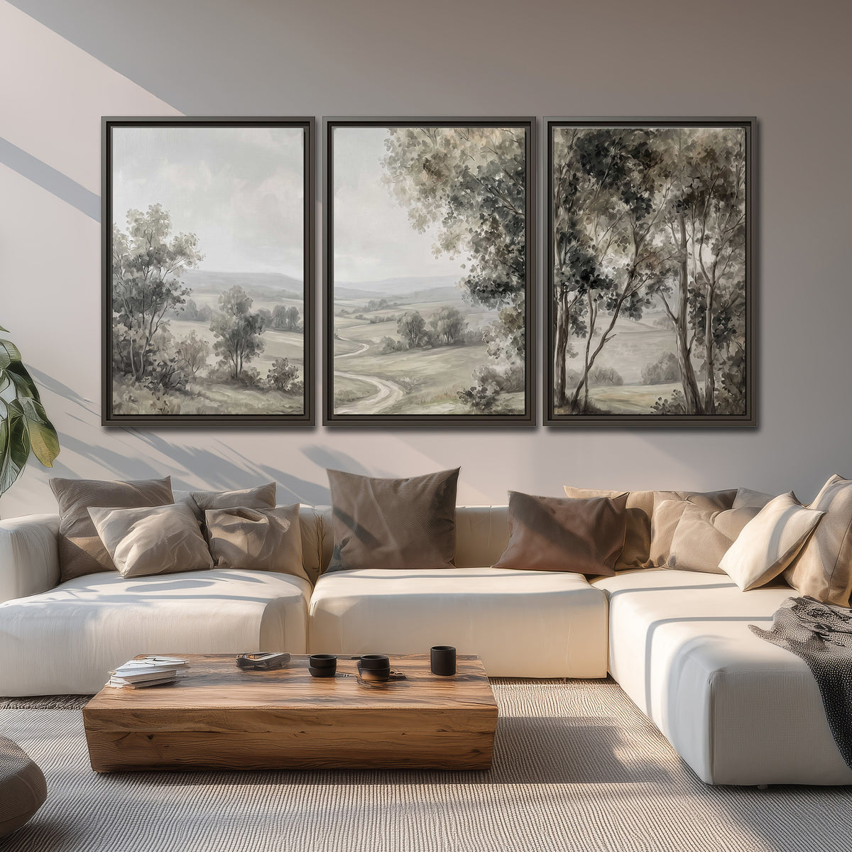 A quiet winding road through gray-green rolling hills 3 piece framed canvas wall art displayed in a living room
