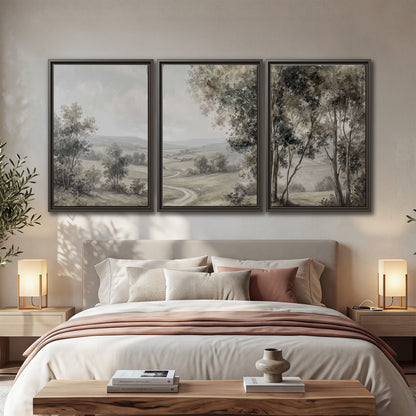 A quiet winding road through gray-green rolling hills 3 piece framed canvas wall art displayed in a bedroom