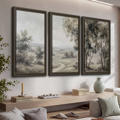 A quiet winding road through gray-green rolling hills 3 piece framed canvas wall art displayed in a console