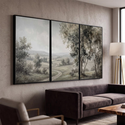 A quiet winding road through gray-green rolling hills 3 piece framed canvas wall art displayed in a modern living room
