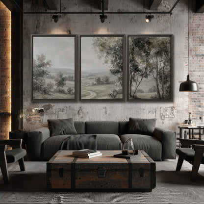 A quiet winding road through gray-green rolling hills 3 piece framed canvas wall art displayed in a industrial room