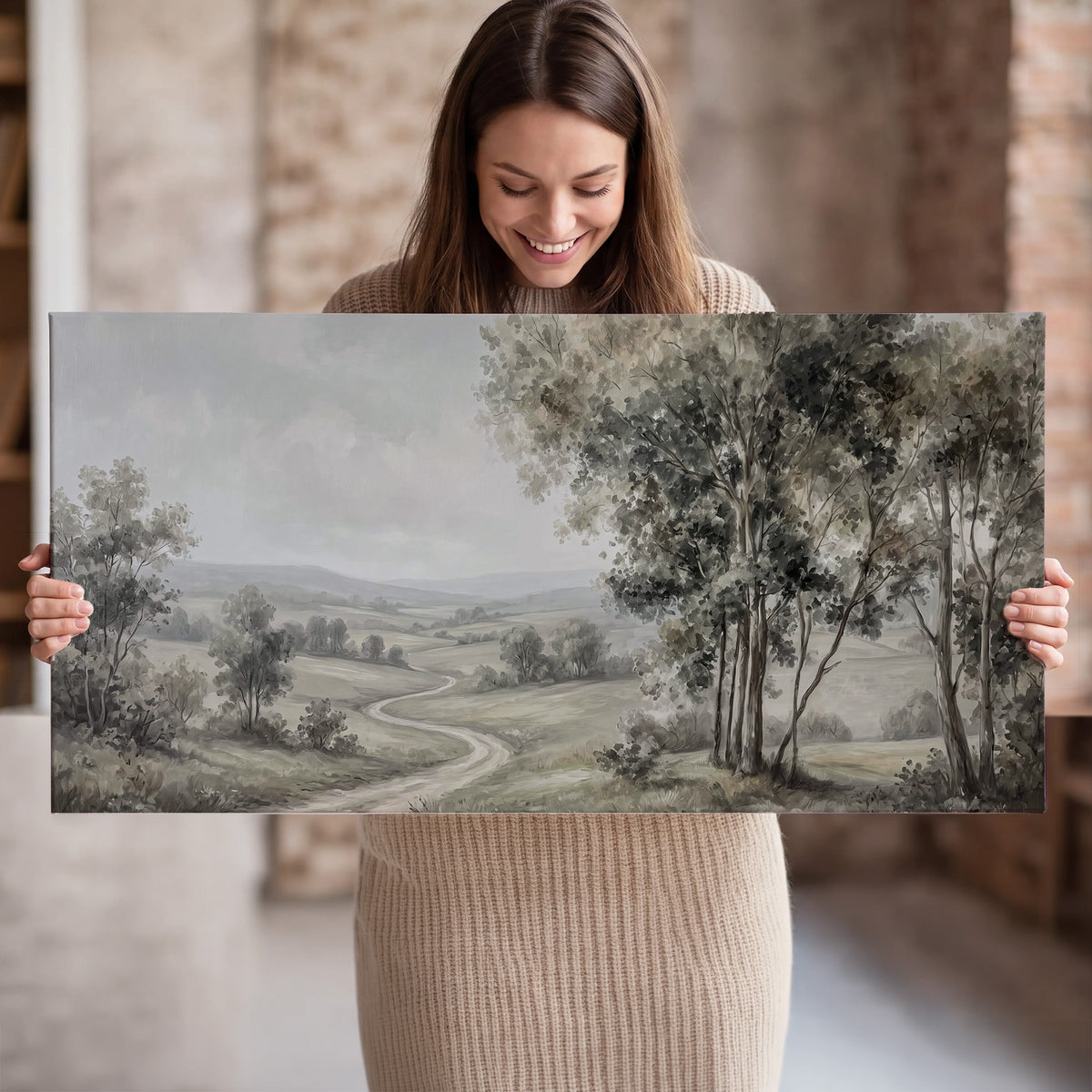 A quiet winding road through gray-green rolling hills single canvas wall art held in hands