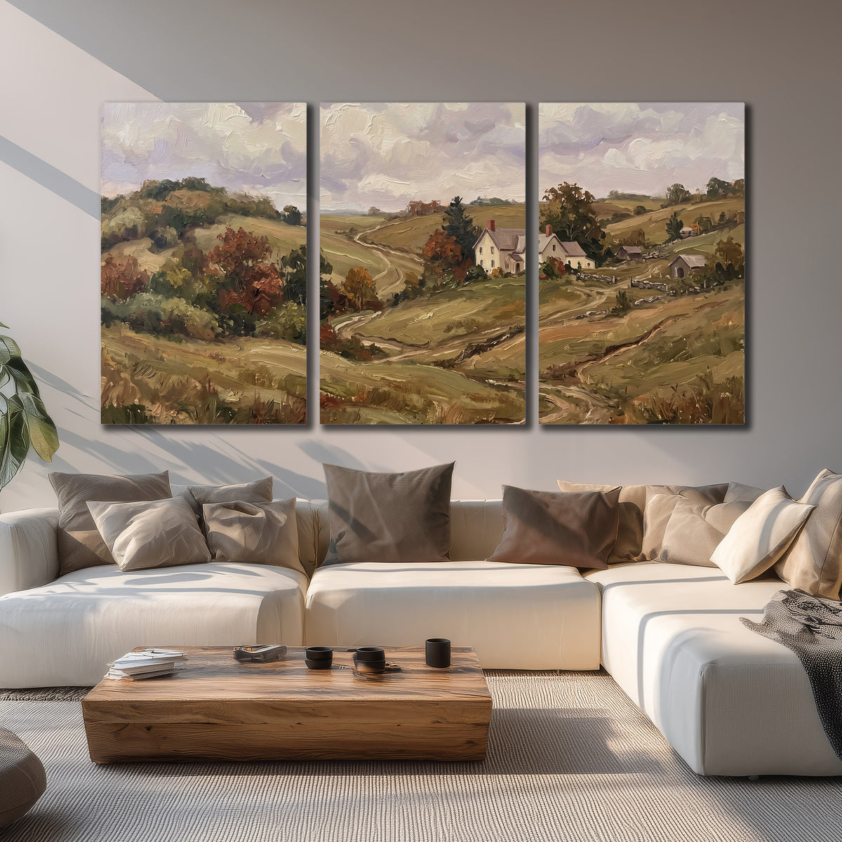 Warm rolling fields and countryside cottages beneath soft clouds 3 piece canvas wall art displayed in a living room