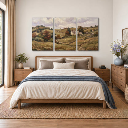 Warm rolling fields and countryside cottages beneath soft clouds 3 piece canvas wall art styled in an interior