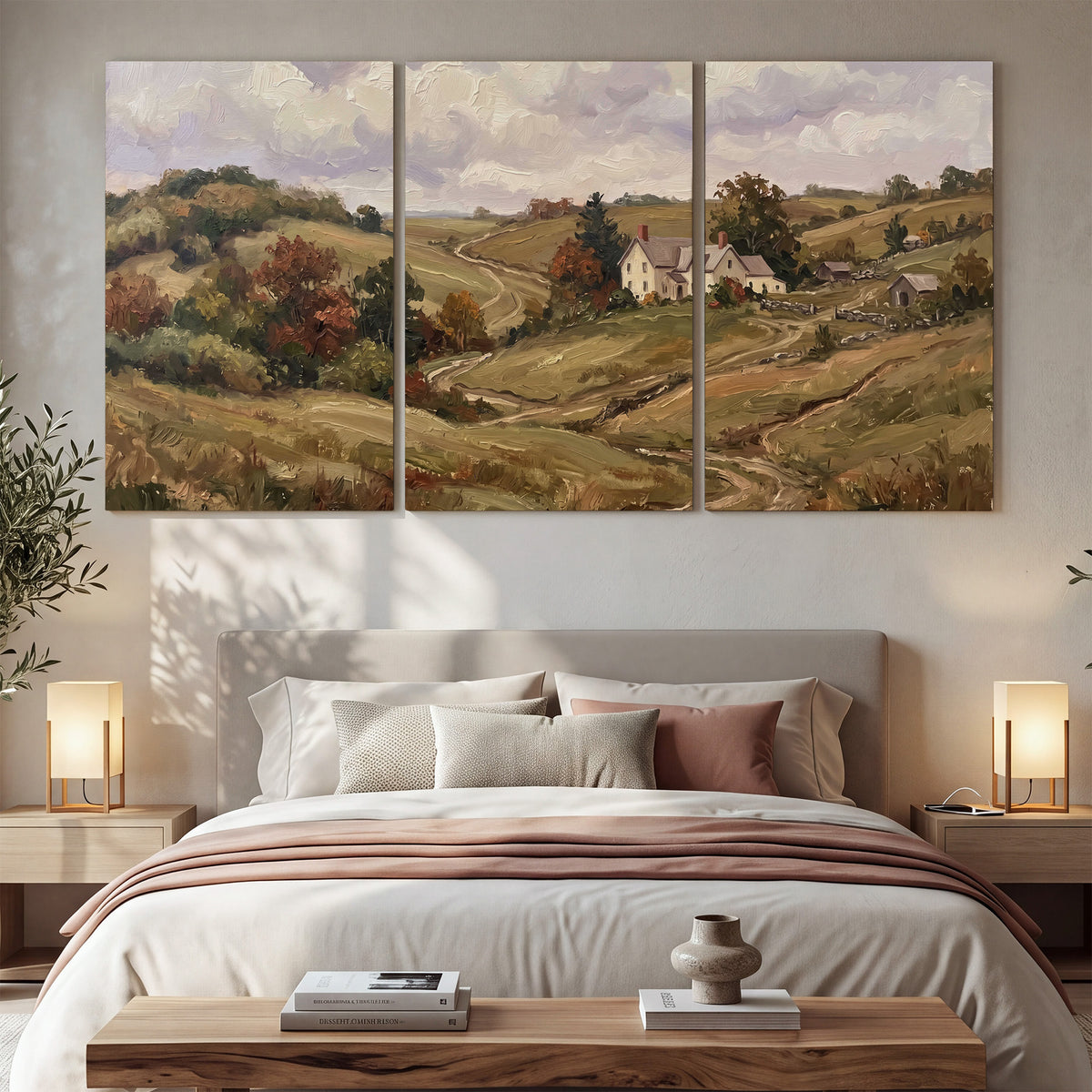 Warm rolling fields and countryside cottages beneath soft clouds 3 piece canvas wall art displayed in a bedroom