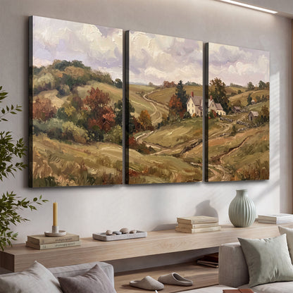 Warm rolling fields and countryside cottages beneath soft clouds 3 piece canvas wall art displayed in a console