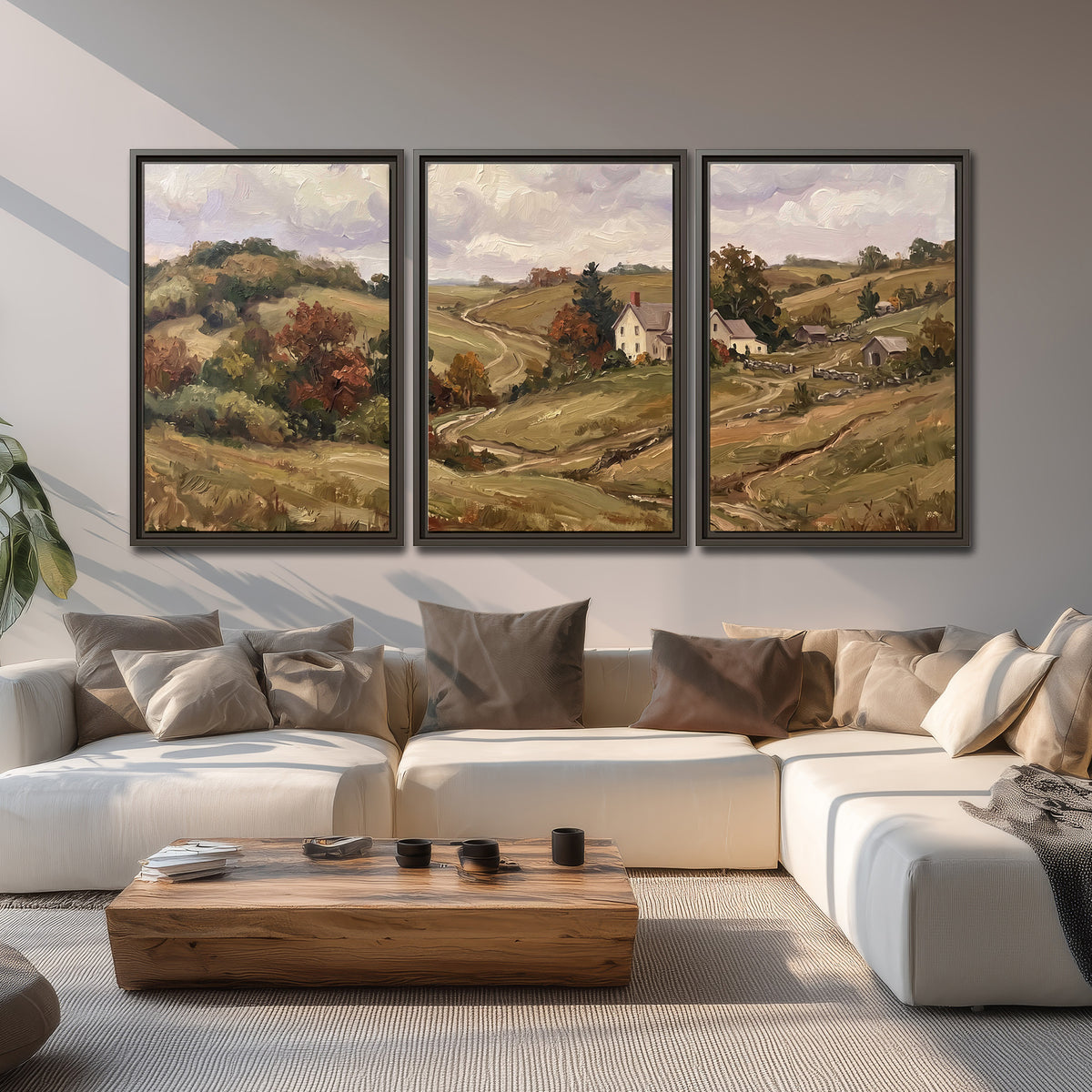 Warm rolling fields and countryside cottages beneath soft clouds 3 piece framed canvas wall art displayed in a living room