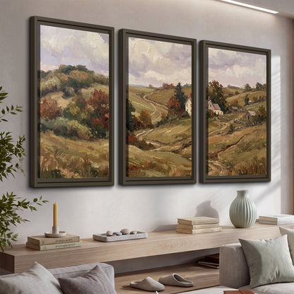 Warm rolling fields and countryside cottages beneath soft clouds 3 piece framed canvas wall art displayed in a console