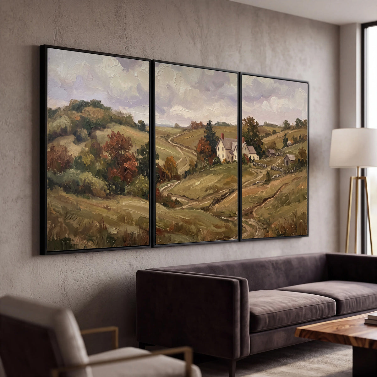Warm rolling fields and countryside cottages beneath soft clouds 3 piece framed canvas wall art displayed in a modern living room