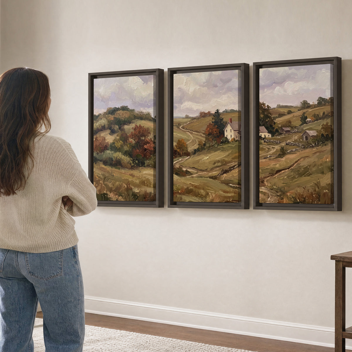 Warm rolling fields and countryside cottages beneath soft clouds 3 piece framed canvas wall art three panel arrangement on a wall