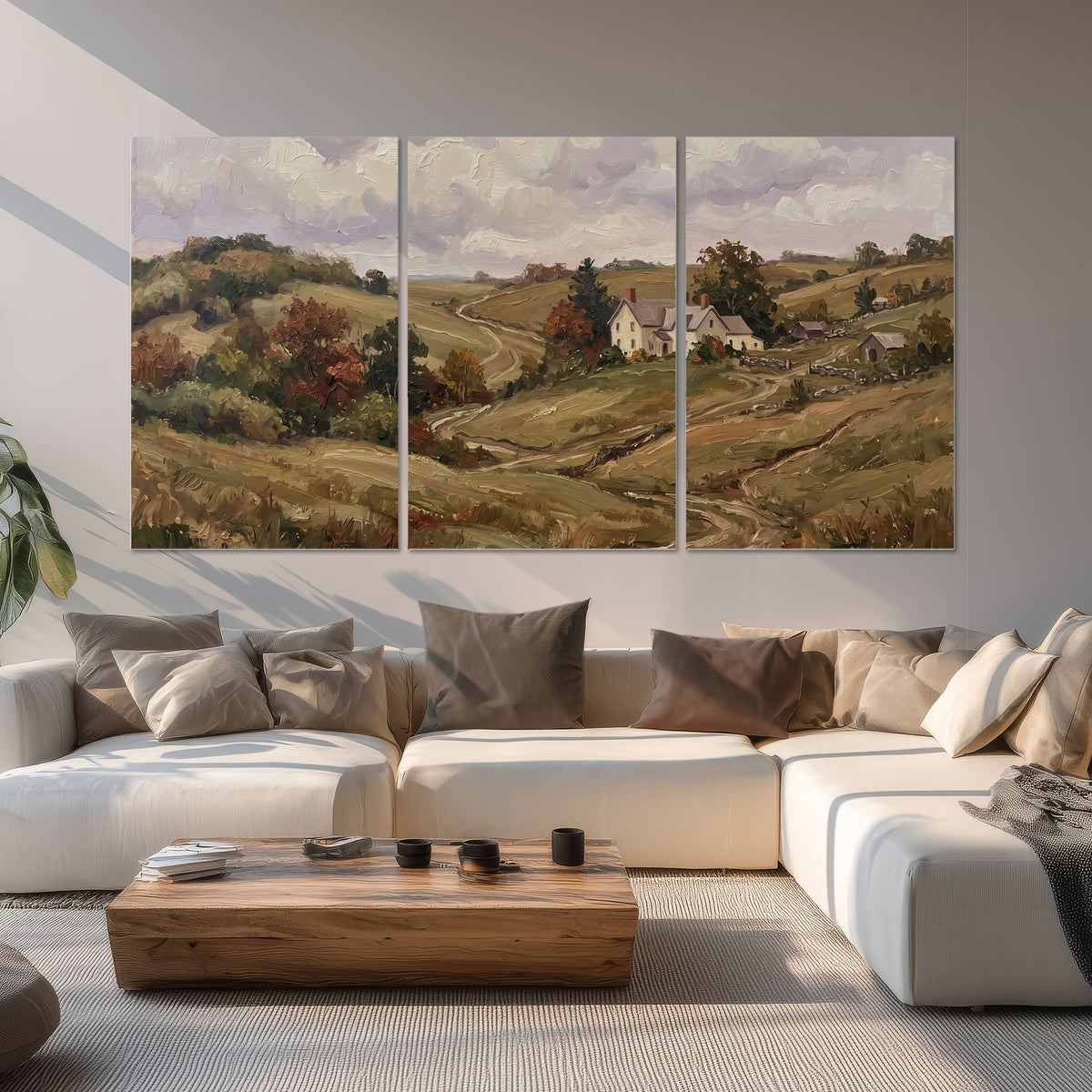 Warm rolling fields and countryside cottages beneath soft clouds set of 3 poster prints displayed in a living room