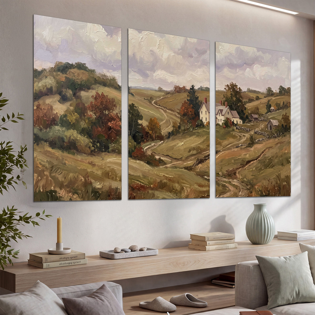 Warm rolling fields and countryside cottages beneath soft clouds set of 3 poster prints displayed in a console